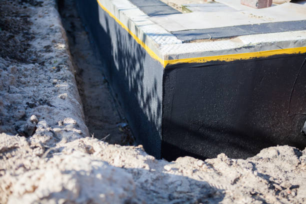 Professional Basement Waterproofing technician working in Decatur, GA